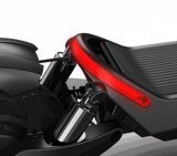 A close-up shot of the rear section of the Panther ES800 Super Electric Scooter by Evolvate Pro, showcasing the sleek black leather seat, silver shock absorber, and a bright red LED tail light strip curving around the back. The image highlights the modern and stylish design details, reminiscent of an electric scooter with off-road tires.